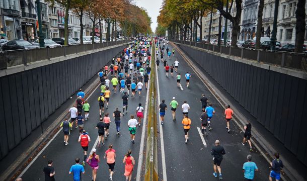 drone photo of a group running a marathon outdoors